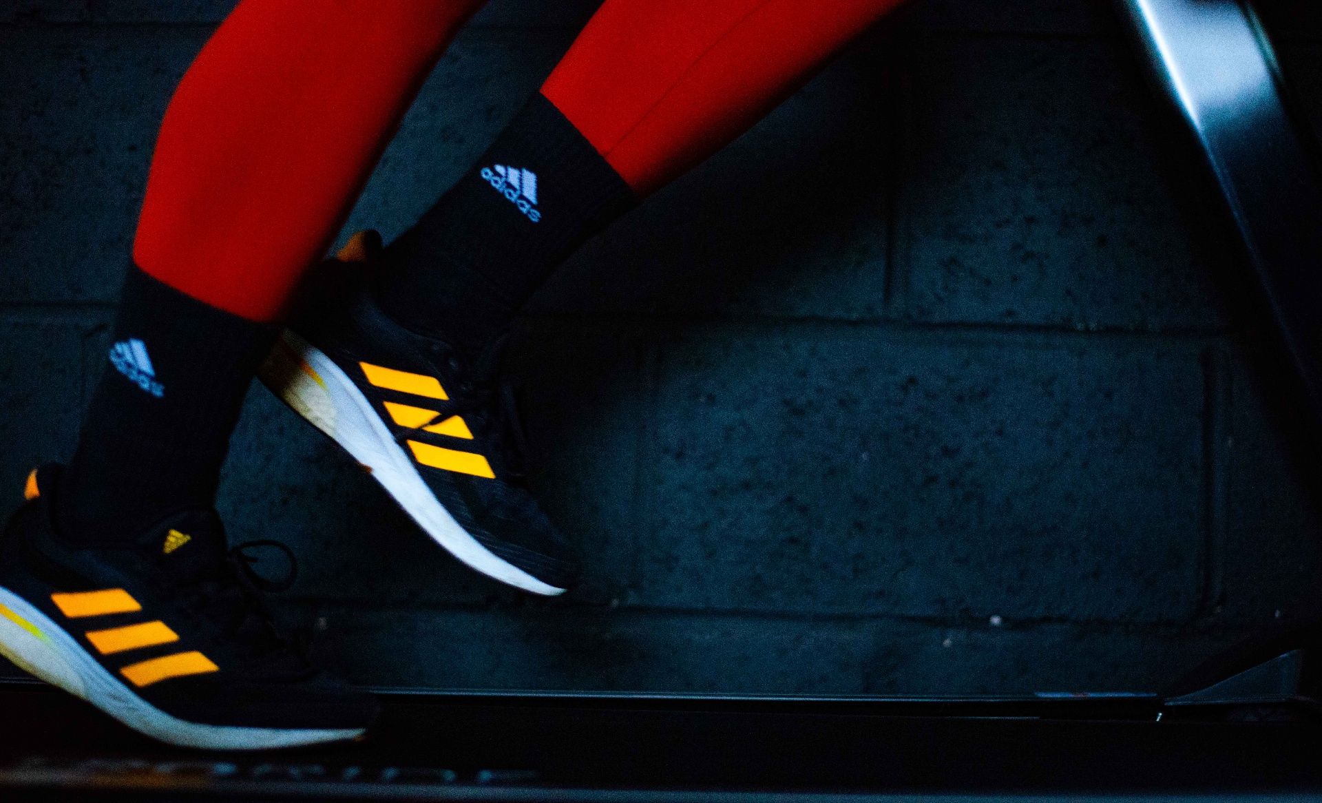 Running shoes mid-stride on a treadmill